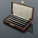 A set of four silver and enamelled bridge pencils