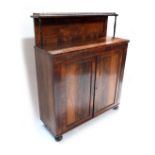 A Regency rosewood pier cabinet of small proportions, circa 1820, raised shelf back with pierced