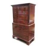 A George III mahogany chest on chest, circa 1800, moulded and Greek key cornice, the upper section