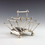 Christopher Dresser for Hukin and Heath, a silver plated six division articulated letter rack