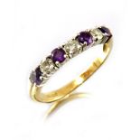 An 18ct gold diamond and amethyst seven-stone ring