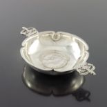 R E Stone, a Modernist commemorative silver quaich, London 1953, planished quatrelobed petal form