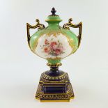 A Royal Worcester pedestal vase and cover, squat baluster twin handled form on knopped stem and