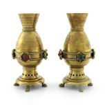 Christopher Dresser for Benham and Froud, a pair of Aesthetic Movement brass altar vases, circa