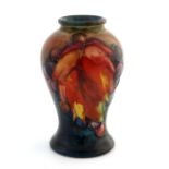 William Moorcroft, a small Flambe Leaf and Berry vase