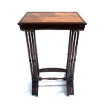 A Regency nest of three rosewood occasional tables, circa 1820, cockbeaded tops, ring turned legs,