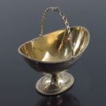 A Victorian silver gilt sugar basket, Thomas Smily, London 1873