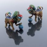 A pair of Chinese silver gilt and enamelled lion figures