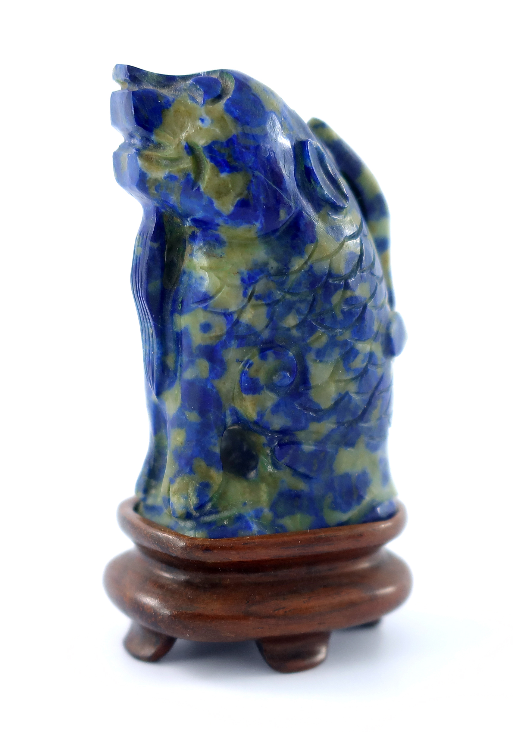 A Chinese carved lapis figural snuff bottle