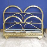 An Art Deco gilt metal double bed head and footboard, probably French 1930's, of reeded scroll