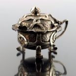 A E Jones, an Arts and Crafts silver mustard pot,