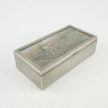 An Edwardian electroplated table cigarette casket of hunting interest, the cover with an inset