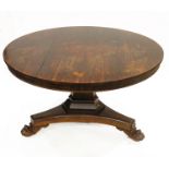 A Regency rosewood breakfast table, circa 1820, circular tilt top, tapered chamfered support,