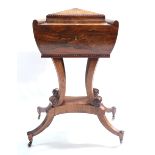 A Regency rosewood teapoy, circa 1820, of sarcophagus form, the hinged cover opening to a fitted