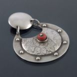 An Arts & Crafts silver coral pendant