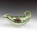 A Worcester polychrome cos lettuce moulded sauce boat
