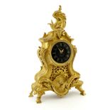A gilt metal bracket timepiece of Rococo design, black enamel dial with gilt Roman numerals signed