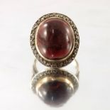 A 9ct gold garnet cabochon and rose-cut diamond cluster ring