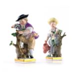 A pair of Meissen figures of gardeners