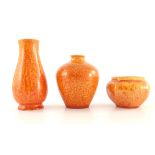 Pilkington, three Royal Lancastrian orange vermilion vases