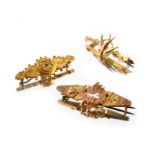 Three Victorian 15ct and 9ct gold brooches
