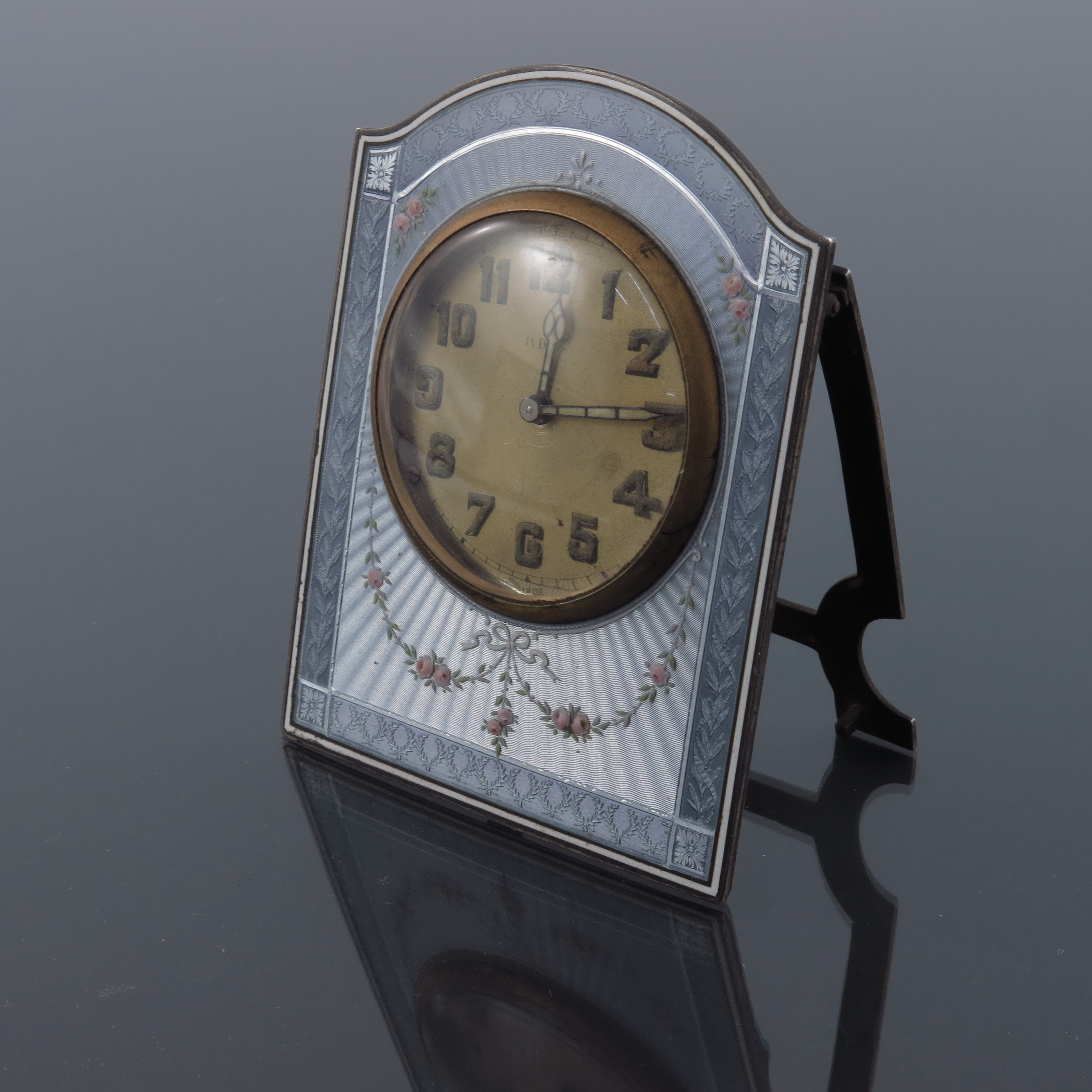 A Swiss silver gilt and enamelled clock, Hase import marks for London 1920, domed rectangular