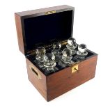 A Victorian rosewood and cut glass six decanter box