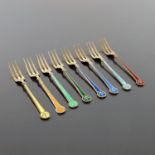 David Andersen, a harlequin set of eight pairs of silver gilt and enamelled fruit spoons and forks