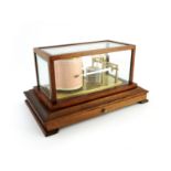 A 20th Century Russell of Norwich barograph, mahogany case with bevelled glass inserts, chart drawer