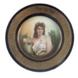 An early 20th Century Rosenthal cabinet plate, painted with a portrait of a classically draped