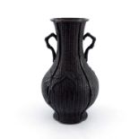 A Japanese bronze baluster twin handled vase