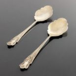 A pair of Arts and Crafts silver serving spoons, Goldsmiths and Silversmiths Company, London 1906/7
