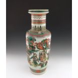 A large 19th Century Chinese rouleau vase, decorated in the famille verte palette with