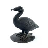 A 19th Century Chinese bronze study of a standing goose, realistic plumage, on a lily pad, all-