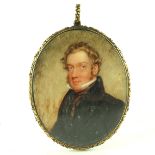 A mid 19th Century oval portrait miniature, circa 1840, a gentleman, bust length wearing a black