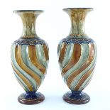 Frank Butler for Doulton Lambeth, a pair of baluster vases, circa 1895, wrythen design in ochre,