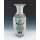 A 19th Century Chinese baluster vase, moulded lion mask and ring handles painted in polychrome in