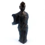 An antique Chinese provincial bronze study of a lady, standing wearing a robe, traces of gilding,
