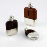 Three George V silver plated and leather hip flasks, Walker and Hall and James Dixon and Sons
