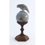 An Oriental lavender aventurine quartz carved orb with eagle surmount,