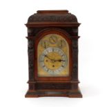 A late Victorian oak cased musical bracket clock,