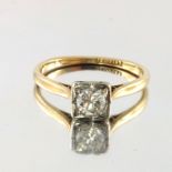 A mid 20th century 18ct gold and platinum diamond single-stone ring