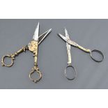 Antique Scissors: two unusual pairs, one in steel the shank with bunches of grapes and leaves in gol