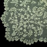 A fine 19th century triangular shawl or veil in Brussels needle lace bordered with flowers and leave