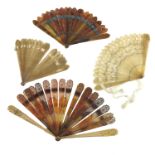 Four early 19th century brisé fans, to include a tortoiseshell (or possibly dyed horn) example, the
