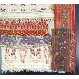 World Textiles, Miscellaneous, to include a panel with five pattern repeats, finely worked on red cl