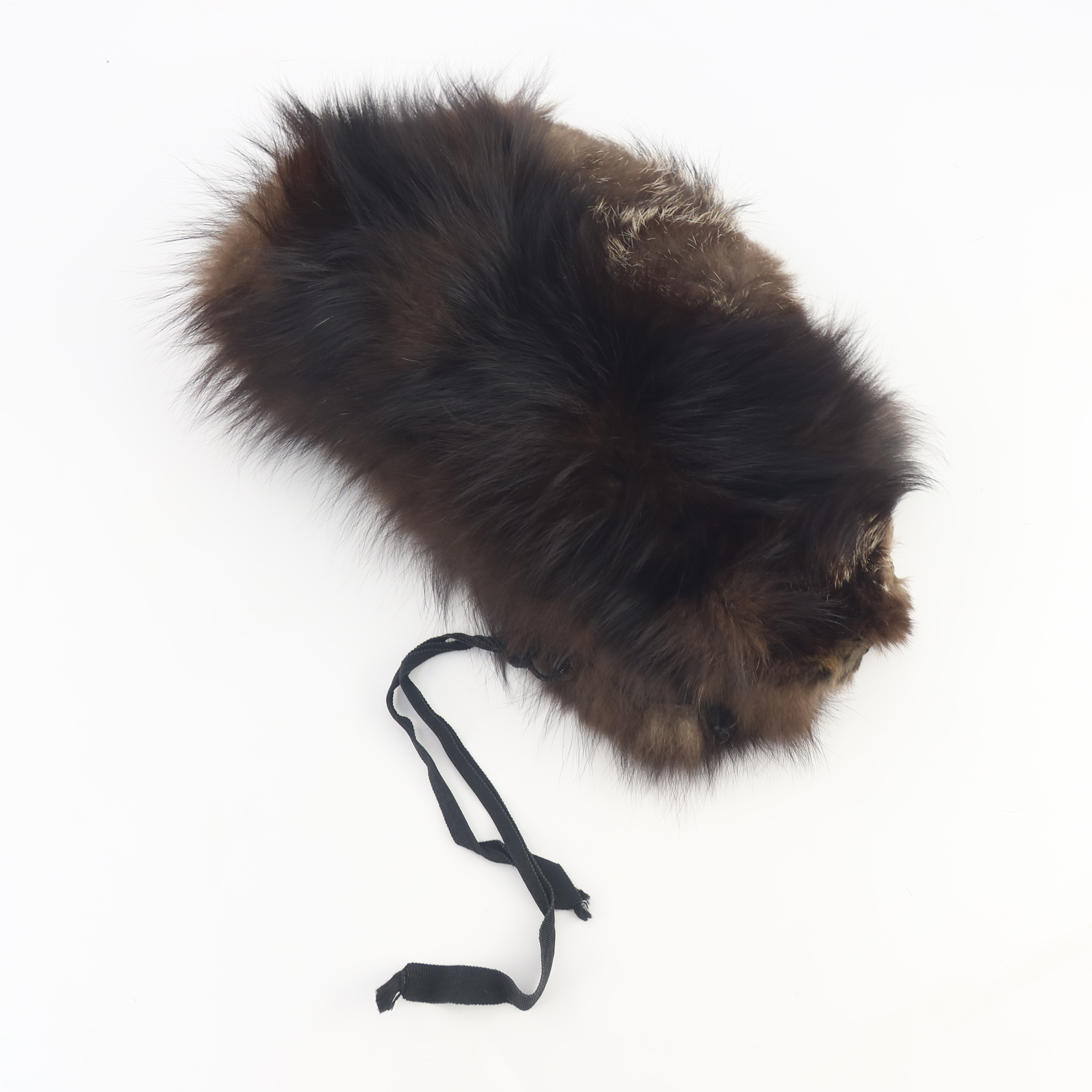 A vintage silver fox fur hat with side panels to cover the ears, perhaps for motoring, front ties an