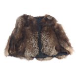 A vintage waist-length silver fox fur cape with slits to slip the arms through, unlabeled, lined in