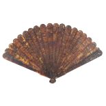 A second quarter 19th century Chinese carved tortoiseshell brisé fan, Qing Dynasty, the nineteen inn