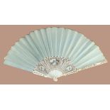 A slender 18th century ivory fan with sea green silk leaf, the monture finely painted with a central